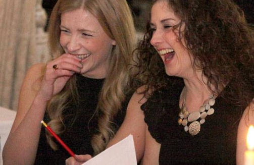 two women playing music bingo'